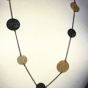 Beautiful disk filigree necklace gold and black.